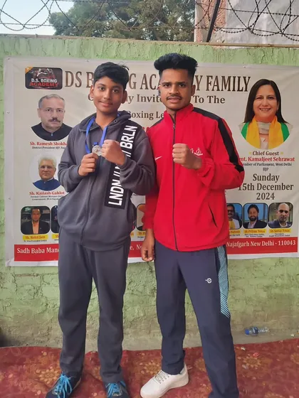 Another one of my promising young fighters proudly showing his medal. These early competitions are crucial for building experience and confidence.