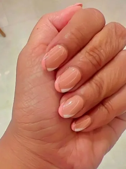 How perfect are these French gel nails with a hint of glitter? The thin silver line adds just the right amount of glam.