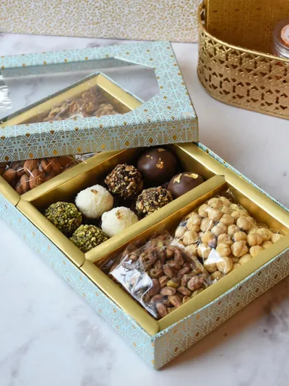 This elegant gift box is designed with separate compartments for my handcrafted chocolate truffles and a selection of premium mixed nuts. The clear window gives a sneak peek of the delicious treats inside.