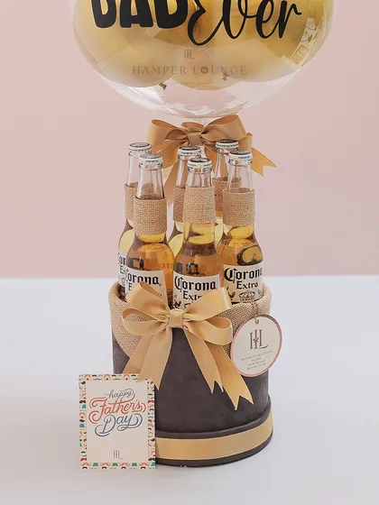 Another angle of the "Best Dad Ever" beer hamper. The combination of the sleek box, golden ribbons, and festive balloon makes it a truly celebratory gift.