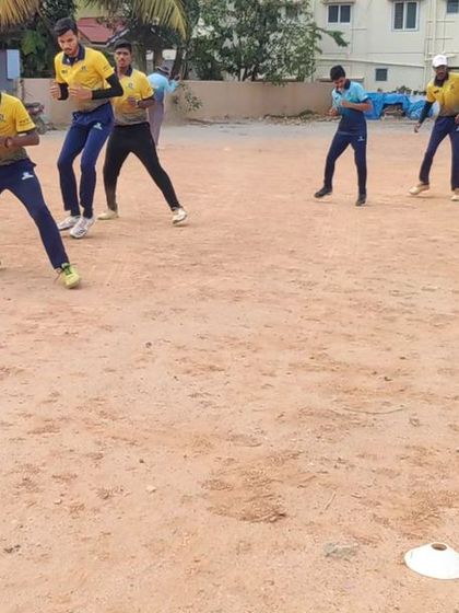 Players practicing their fielding stance. A ready and athletic posture is the first step to becoming a sharp and effective fielder.