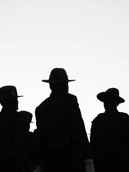 A black and white version of the silhouette of soldiers, emphasizing their forms and the negative space. This high-contrast image feels timeless and powerful.