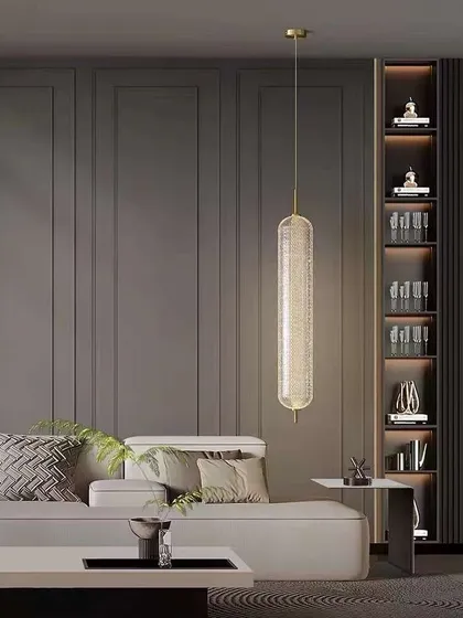 A long, textured glass pendant light. This elegant fixture is perfect for adding a touch of sophistication to a living room or hallway.