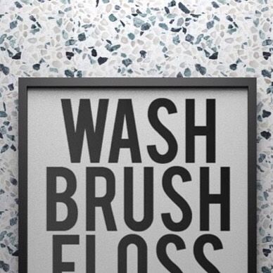 A concept for a minimalist powder room, featuring a bold graphic print against a terrazzo feature wall. This design shows how to make a big impact in a small space using pattern and contrast.