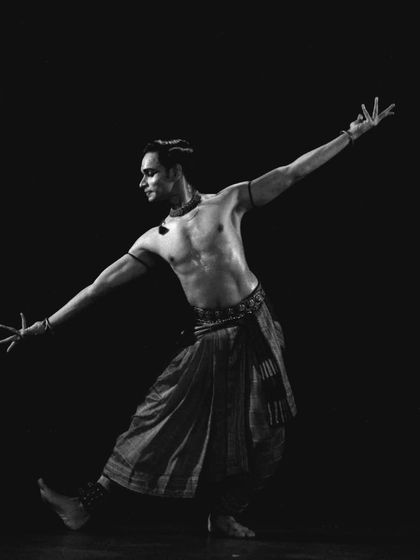 A black and white capture from the NCPA Mumbai concert, highlighting the form and lines of the body.