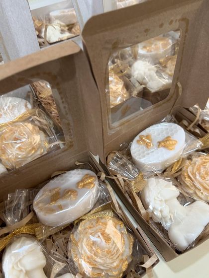 Another angle of the custom white and gold gift boxes, showing how I can mix and match different sculptural designs to fit a client's aesthetic.