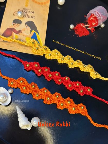 Our unisex rakhi designs feature a simple, elegant floral chain with bead details. They are perfect for anyone who has your back.