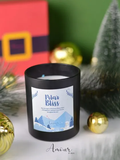'Polar Bliss' is a classic vanilla-scented candle in a black jar, perfect for creating a serene and peaceful winter vibe.