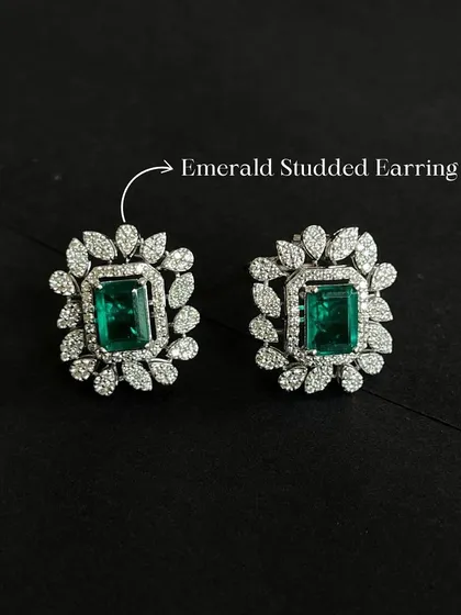 Get ready for the festive season with these emerald and diamond studded earrings. The rich green of the emerald provides a beautiful contrast to the sparkle of the surrounding diamonds.