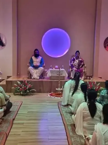Participants meditating at our Bangalore centre, seen from the back. This perspective emphasizes the collective focus and shared spiritual experience of the group.