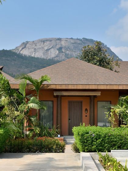A clear view of one of our boutique bungalows with the majestic Nandi Hills in the background. This is the signature view that defines a stay at Mulberry Shades.