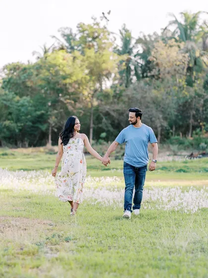 A candid shot of the couple taking a walk through a field of wildflowers. I love capturing these simple, in-between moments that feel so natural and full of life.