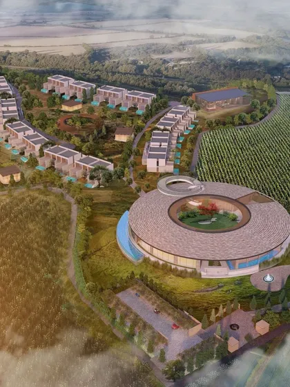 This conceptual masterplan for a project nestled within vineyards features a circular pavilion as its centerpiece. The design celebrates craftsmanship and the surrounding nature, creating a sensory journey that blends the essence of wine and architecture.