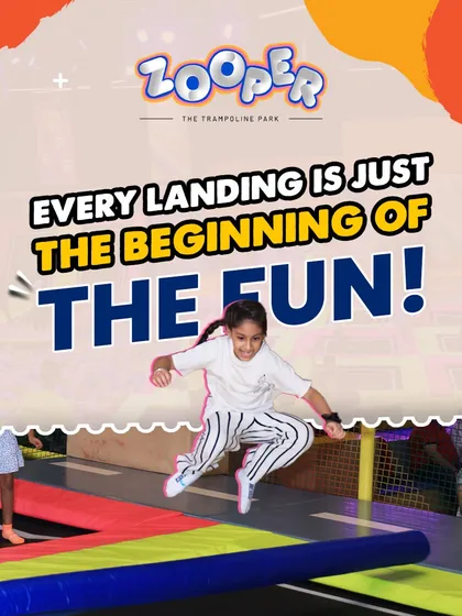 Every landing is just the beginning of the fun. A young guest prepares for her next jump on our colorful, safe trampolines.