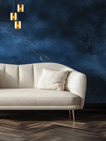 A different angle of the minimalist wall lights, showing how their warm glow interacts with the textured blue wall. This is a fusion of radiance and sophistication, crafted to inspire the senses.