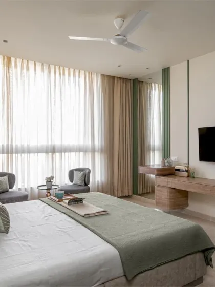 I built this entire master bedroom set to create a calm and sophisticated retreat. The project included the faux leather-clad bed, the floating TV console, and the pair of houndstooth-patterned chairs by the window. It shows how I deliver a complete, cohesive furniture solution for a room.