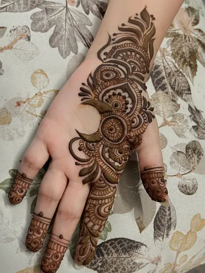 A creative moon-inspired design for a client. This is a perfect example of a modern, artistic take on henna.