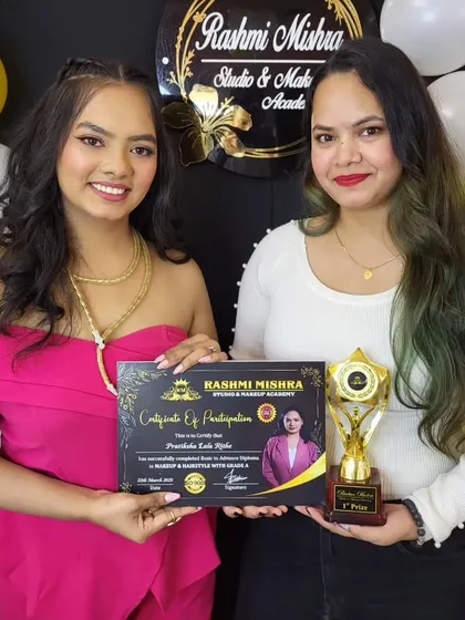 Another one of my students receiving her certificate and award for her excellent performance throughout the nail artistry program.