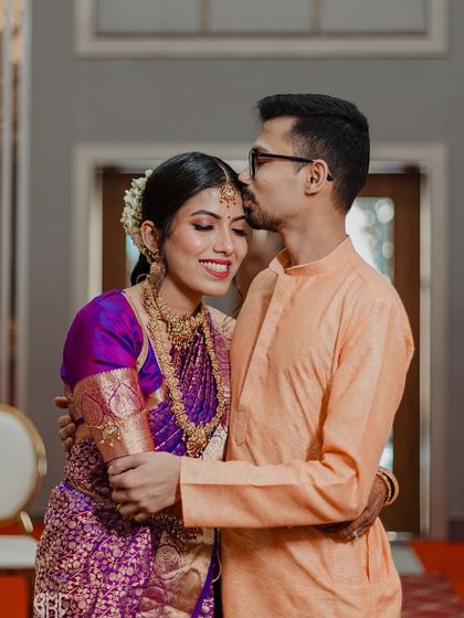 A tender kiss on the forehead, a silent promise of care and affection. These intimate moments between the couple are the soul of our wedding photography.