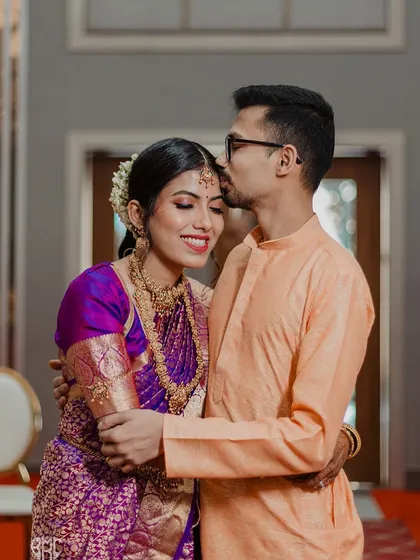 A tender kiss on the forehead, a silent promise of care and affection. These intimate moments between the couple are the soul of our wedding photography.