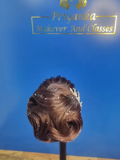 The back view of the same hairstyle, highlighting the beautiful wave pattern created in the bun.