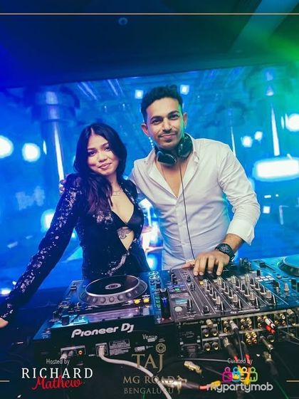 Sharing the decks with a fellow artist at the NYE 2025 event. Collaboration is key in the music world.