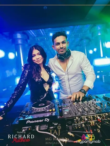Sharing the decks with a fellow artist at the NYE 2025 event. Collaboration is key in the music world.