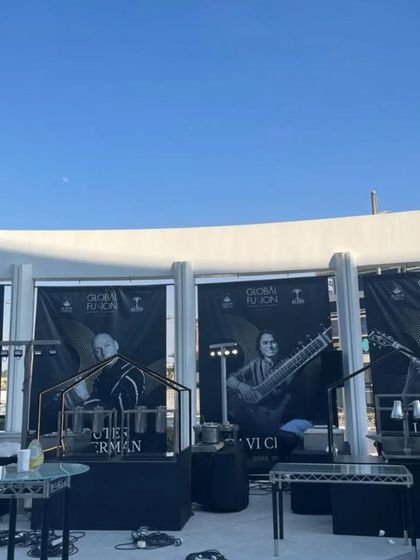 The venue setup for the Global Fusion concert, with posters of all the international artists.