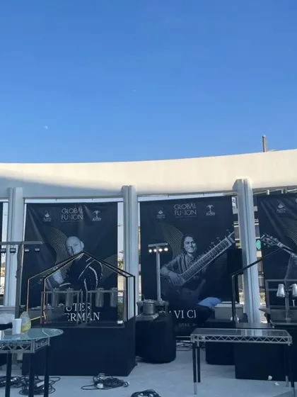The venue setup for the Global Fusion concert, with posters of all the international artists.