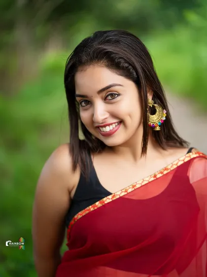 A close-up shot that captures a genuine, dimpled smile. This type of headshot is perfect for an actor's portfolio, showing warmth and personality.