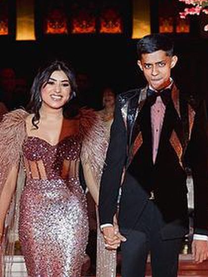 The bride and groom making their grand entrance, ready to start their new life together with a dance.