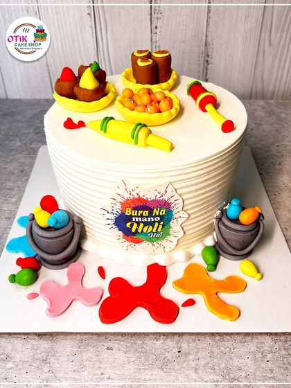 "Bura na mano, Holi hai!" This fun Holi-themed cake is decorated with edible 'pichkaris', 'gulaal', and color splashes, capturing the playful spirit of the festival.