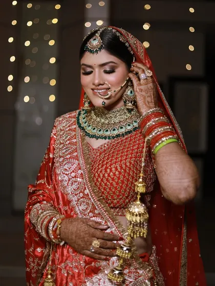 Adjusting the final details. I fuss over every little thing, from the kalire to the nath, so that my bride feels completely comfortable and looks perfect from every angle.