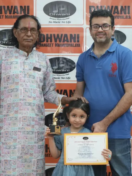 A student with her father and our senior guru, a proud moment for all.