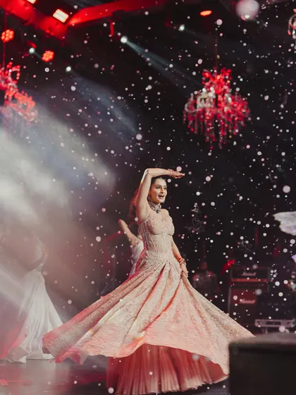 We design the ambience to make every performance shine. Here, the bride’s graceful solo is elevated with ethereal bubble effects and dramatic lighting, turning her dance into a true centerpiece of the evening.