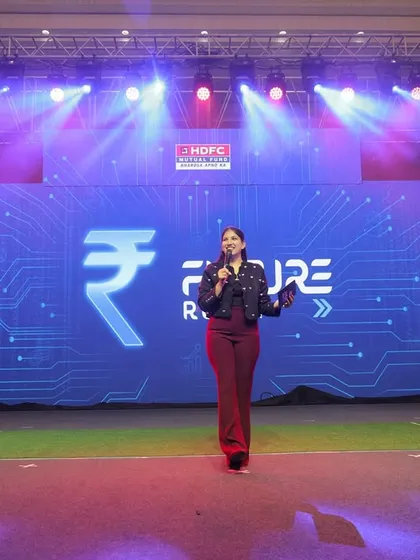 Commanding the stage for HDFC Mutual Fund's 'Future Ready' event. A wide shot showing the scale of the production and my presence as the central host for the evening.