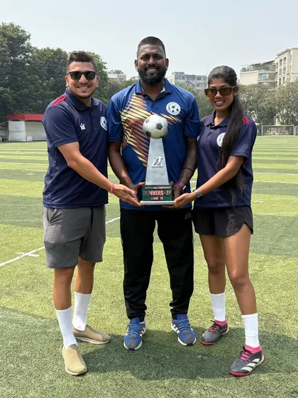 A proud moment for our coaches, holding the winners' trophy. This is a result of months of dedication, hard work, and teamwork from everyone at the academy.