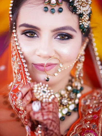 A close-up shot focusing on the bride's expressive eyes and flawless makeup. Capturing these details is essential for a complete bridal lookbook.