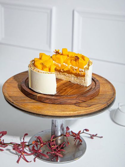 Layers of goodness. A slice reveals the inside of our elegant mango cake.