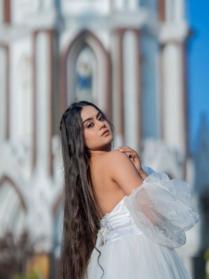 A dreamy, angelic look for a Christmas themed shoot. The makeup is soft and ethereal, with a focus on glowing skin and long, flowing hair.