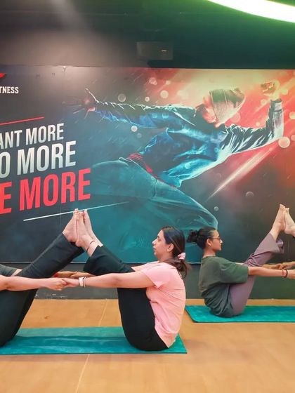 Partner Boat Pose (Navasana) builds incredible core strength and requires synchronized balance. It's a challenging but rewarding pose we practice in our classes.