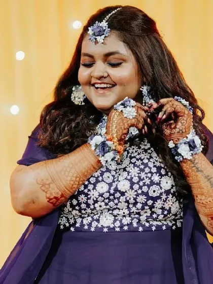 The deep colour of the mehendi on her arms is a testament to the quality of our natural henna.