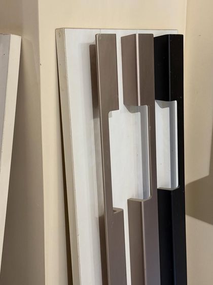 A display of our long profile handles in various finishes. The right hardware is crucial for completing the look of your bespoke wardrobe or cabinet.