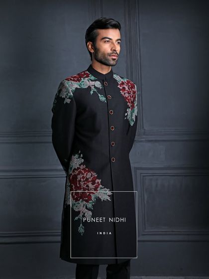 Wrap yourself in the grandeur of my classic black achkan, where every stitch and every vintage rose embroidery whispers luxury and poise.