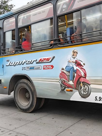 A closer look at the bus advertisement for TVS Jupiter. My image was a central part of the branding, showcasing the scooter in an everyday, relatable context.