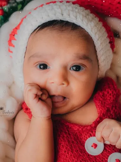 That curious expression is just too cute. This little one is wondering if Santa is on his way.