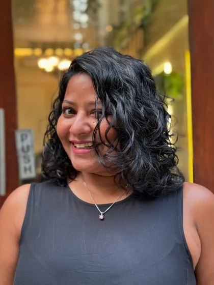 A classy curly bob is always a good idea. This timeless haircut is perfect for adding shape and volume, creating a chic and easy-to-manage style for wavy and curly hair.