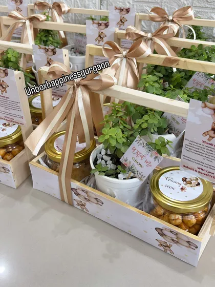 An angled shot of the baby shower return gifts, showing how the neutral-toned ribbons and teddy bear illustrations create a cohesive and charming look.
