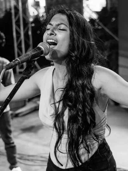 A moment of pure passion captured during a live performance. This black and white shot really shows the emotion I pour into every song, connecting with the audience through the power of vocals.