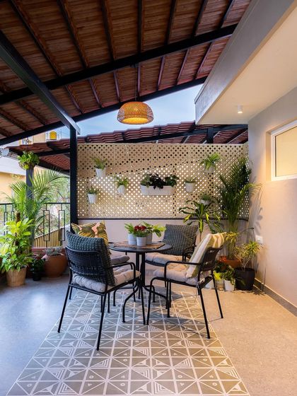 An evening view of the terrace, where the combination of natural textures and warm lighting creates an inviting atmosphere for outdoor living.